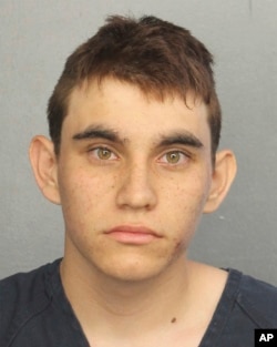 This photo provided by the Broward County Jail shows Nikolas Cruz. Authorities say Cruz, a former student opened fire at Marjory Stoneman Douglas High School in Parkland, Fla., Wednesday, Feb. 14, 2018