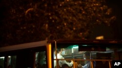 A man wearing a face mask to protect against COVID-19 rides a public bus in Beijing, Sept. 15, 2021.