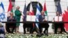 USA, Washington, Bahrain’s Foreign Minister Abdullatif Al Zayani applauds as Israel's Prime Minister Benjamin Netanyahu, U.S. President Donald Trump and United Arab Emirates (UAE) Foreign Minister Abdullah bin Zayed display their copies of signed agreemen