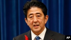 Japan's Prime Minister Shinzo Abe speaks on a sales tax hike during a press conference at the prime minister's official residence in Tokyo, Oct. 1, 2013. 