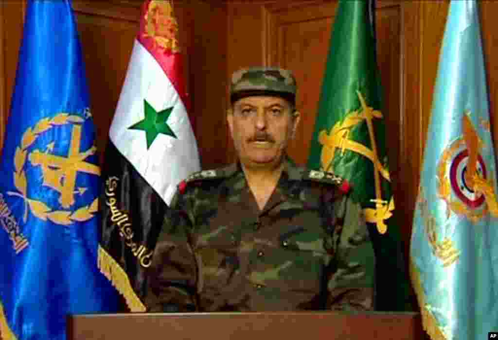 In this image released by the Syrian official news agency SANA, Fahd Jassem al-Freij, Syria&#39;s new defense minister, reads a statement after he was appointed by President Bashar Assad on July 18, 2012.
