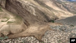 An ariel view shows site of Friday's landslide that buried Abi Barik village in Badakhshan province, northeastern Afghanistan, May 5, 2014.