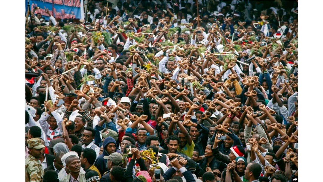 FILE - In this Sunday, Oct. 2, 2016 file photo, protesters chant slogans against the government during a march in Bishoftu, in the Oromia region of Ethiopia.