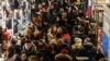 A large crowd of people shop during a Black Friday sales event at Macy's flagship store on 34th St. in New York City, U.S., Nov. 22, 2018. 