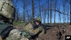 Ukrainian military servicemen control their position during a ceasefire outside Avdiivka, eastern Ukraine, April 16, 2016. 