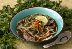 Pho Bo, Beef Noodle Soup is seen in this Sunday, May 18, 2008 photo. Packed with noodles, beef and vegetables this Pho Bo, Beef Noodle Soup, is thought to have it's origins in northern Vietnam. (AP Photo/Larry Crowe)