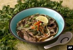 FILE - Pho Bo, Beef Noodle Soup is seen in this Sunday, May 18, 2008 photo. Packed with noodles, beef and vegetables this Pho Bo, Beef Noodle Soup, is thought to have it's origins in northern Vietnam. (AP Photo/Larry Crowe)