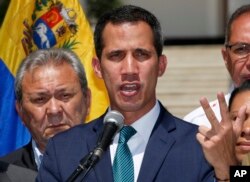 Opposition leader Juan Guaido, who has declared himself the interim president of Venezuela, speaks during a press conference on the steps of the National Assembly in Caracas, Venezuela, Monday, Feb. 4, 2019.