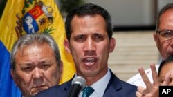 Opposition leader Juan Guaido, who has declared himself the interim president of Venezuela, speaks during a press conference on the steps of the National Assembly in Caracas, Venezuela, Monday, Feb. 4, 2019.