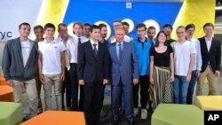 Russian President Vladimir Putin, center, poses for a photo with students while visiting the Sirius Educational Centre for Gifted Children in the Black Sea resort of Sochi, Russia, Saturday, Sept. 1, 2018. (Alexei Druzhinin, Sputnik, Kremlin Pool Photo vi