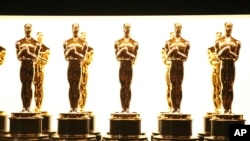 FILE - Oscar statuettes appear backstage at the Oscars in Los Angeles. 