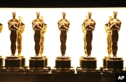 FILE - Oscar statuettes appear backstage at the Oscars in Los Angeles.