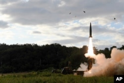 In this photo provided by South Korea Defense Ministry, South Korea's Hyunmoo II ballistic missile is fired during an exercise at an undisclosed location in South Korea, Sept. 15, 2017.