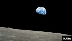 Earth is seen above the Moon's limb, in this handout picture taken by the Apollo 8 crew nearly half a century ago, on December 24, 1968, courtesy of NASA.