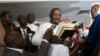 Opposition candidate and former military junta leader Julius Maada Bio takes his oath as Sierra Leone's new president, in Freetown, April 4, 2018. 