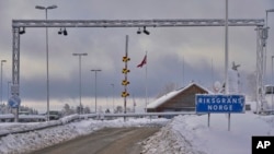 A sign at the entrance of the border post informs travelers that they are entering Norway, Feb. 8 2019. Norway's membership in the European Economic Area grants it access to the common market and most goods are exempt from paying duties but everything entering must be declared and cleared through customs.