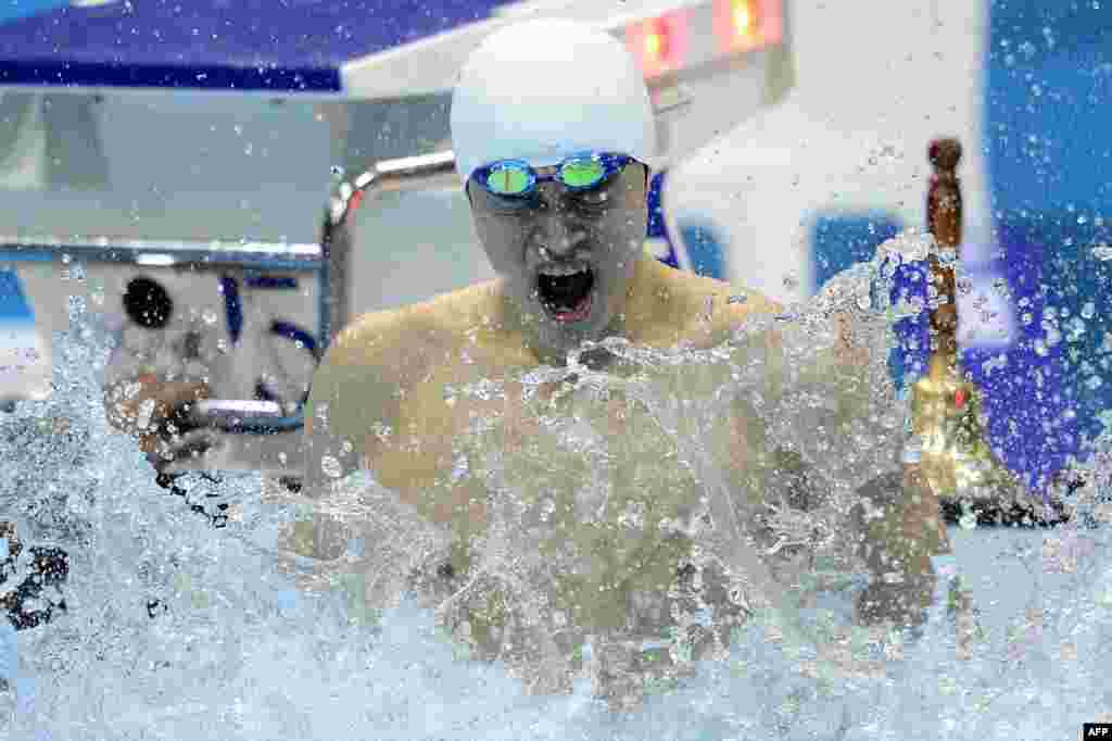 China's Sun Yang reacts after he won gold in the men's 1500m freestyle final during the swimming event at the London 2012 Olympic Games on August 4, 2012 in London. 