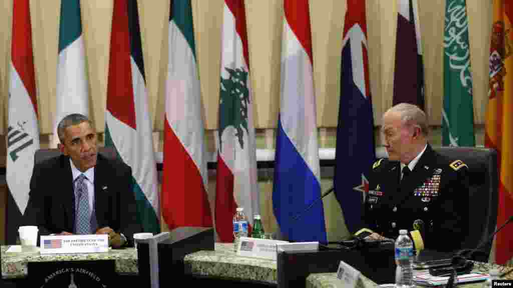 U.S. President Barack Obama speaks at a meeting with more than 20 foreign defense chiefs to discuss the coalition efforts in the ongoing campaign against Islamic State militants at Joint Base Andrews in Washington, Oct. 14, 2014. 