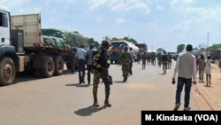 Troops from C.A.R. and Cameroon gather to escort trucks in Garoua Boulai, Cameroon, June 8, 2019. 