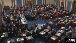 This still image taken from a US Senate webcast shows Senators voting during the impeachment trial of the US president in the Senate Chamber at the US Capitol on February 5, 2020 in Washington, DC.