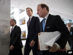 FILE - White House senior adviser Jared Kushner, center, and his attorney Abbe Lowell, right, depart Capitol Hill in Washington, July 24, 2017.