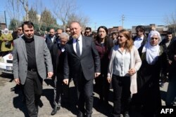 FILE - Co-leader of the pro-Kurdish Peoples' Democratic Party (HDP), Sezai Temelli, center, attends Kurdish activist Zulkuf Gezen's funeral in the Turkish city of Diyarbakir, March 18, 2019.