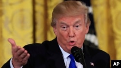 President Donald Trump speaks to a gathering of mayors in the East Room of the White House in Washington, Jan. 24, 2018.