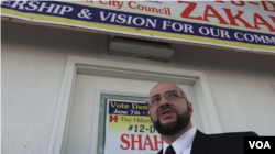 Khairullah at his political headquarters on North Eighth Street. He is not up for reelection this year, but he is canvassing for council candidates that share his vision for the town. (R. Taylor / VOA)