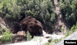 The fourth tunnel of Punggye-ri nuclear test ground is blown up during the dismantlement process in Punggye-ri, North Hamgyong Province, North Korea, May 24, 2018.
