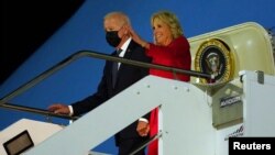U.S. President Joe Biden and first lady Jill Biden arrive at Fiumicino airport in Rome, Italy, Oct. 29, 2021. 