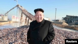 FILE - North Korea's leader Kim Jong Un visits a Korean People's Army fishery station.