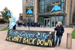Opponents of Enbridge Energy's plan to replace its aging Line 3 crude oil pipeline across northern Minnesota, protest Tuesday, Oct. 1, 2019, in St. Paul, before a state Public Utilities Commission meeting on the project.
