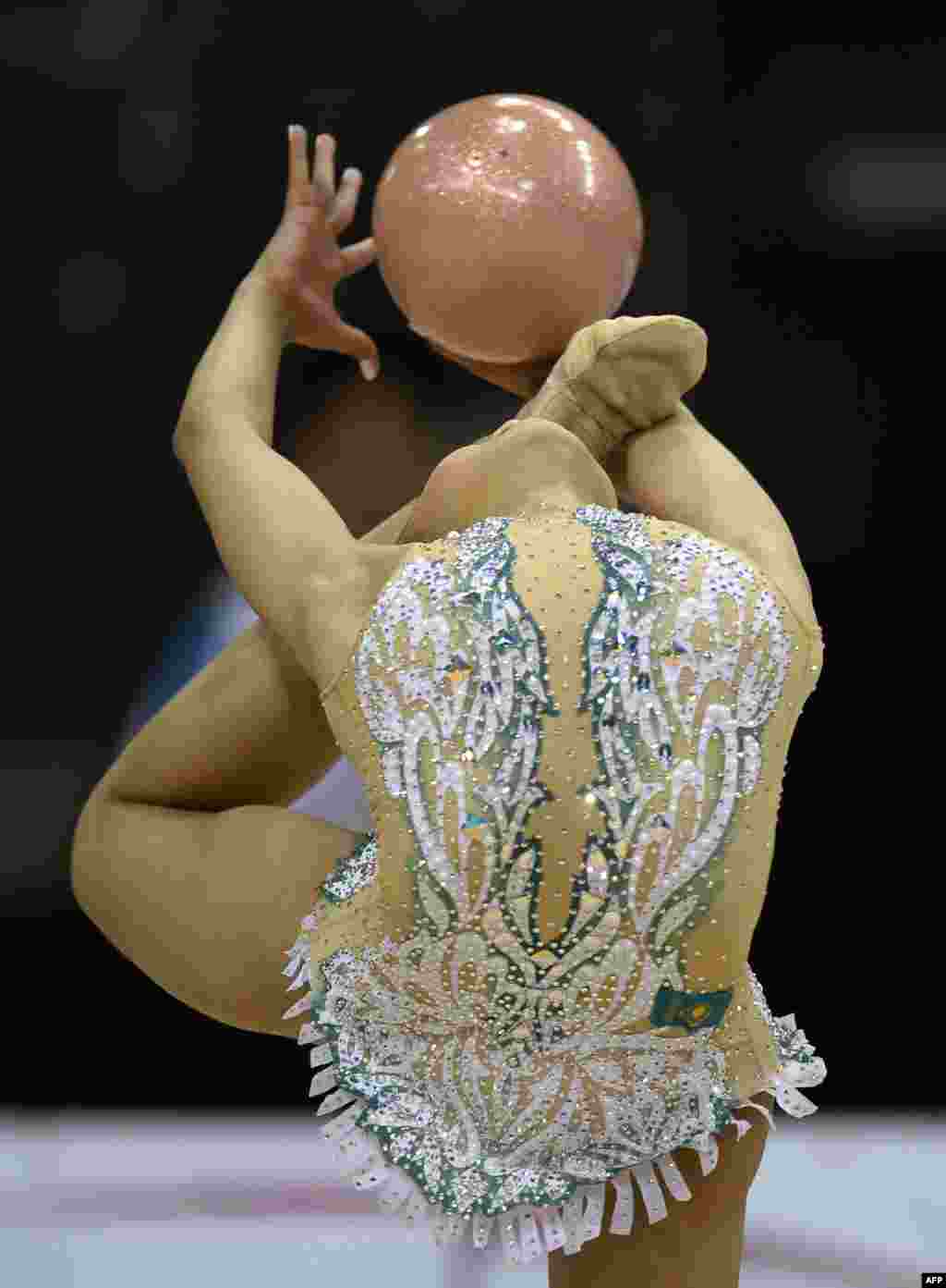 Aliya Assymova of Kazakhstan performs with the ball in the individual qualifications at the World Rhythmic Gymnastics Championships in Stuttgart, southwestern Germany. &nbsp;