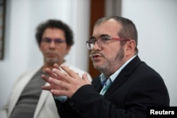FILE - Colombia's Marxist FARC rebel leader Rodrigo Londono, known as Timochenko, speaks during a news conference in Bogota, Colombia, Nov. 25, 2016