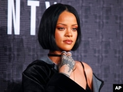 FILE - Rihanna attends the Fenty Puma by Rihanna fashion show in New York.