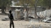 FILE - A picture taken on February 17, 2015 shows a Cameroonian soldier walking in the Cameroonian town of Fotokol, on the border with Nigeria, after clashes occurred on Feb. 4 between Cameroonian troops and Nigeria-based Boko Haram insurgents. 