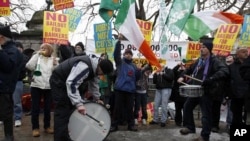 Demonstrators protest outside Government Buildings as the budget is announced, in Dublin, 07 Dec 2010