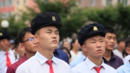 People watch a news broadcast on a missile launch in Pyongyang, North Korea, July 29, 2017. North Korean leader Kim Jong Un said the second flight test of an intercontinental ballistic missile demonstrated his country could hit the U.S. mainland.