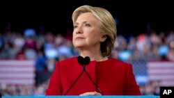 Democratic presidential candidate Hillary Clinton pauses as she speaks during a campaign rally in Raleigh, N.C., Nov. 8, 2016. 