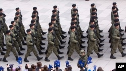 Kosovo Security Force members parade in the center of Pristina marking the 5th anniversary since Kosovo seceded from Serbia, Feb. 17, 2013. 