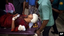 afida Ahmed, wife of a prominent Bangladeshi-American blogger, Avijit Raoy is being rushed to hospital on a stretcher after she was seriously injured by unidentified attackers, in Dhaka, Bangladesh, Feb. 25, 2015.