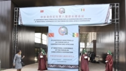 Senegalese delegates enter the conference hall during the China-Africa Cooperation (FOCAC) meeting at the Diamniadio in Dakar, Senegal, Nov. 29, 2021.