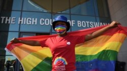 Activists carry a rainbow flag outside the Botswana High Court, Oct. 12, 2021.