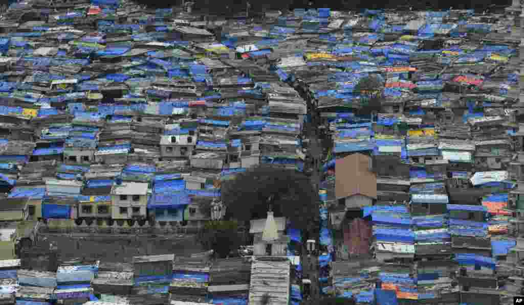 Roofs of shanties are covered with plastic sheets as protection against monsoon rains in Mumbai, India.