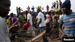 People sell clothes at the displaced camp at Mpoko international airport in Bangui, Central African Republic, Feb. 26, 2014.