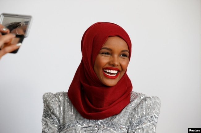 Fashion model and former refugee Halima Aden has her makeup applied during a shoot at a studio in New York City, Aug. 28, 2017.