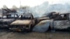Des voitures brûlées après une attaque dans un parking à Maiduguri, au Nigeria, vendredi 17 février 2017.