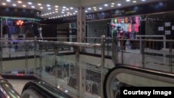 Stores were open in a shopping mall in Baneh, Iran, May 18, 2018, but it was virtually deserted of customers who have stayed away from the city. Local residents blame the lack of business on Tehran’s monthslong blockade of border footpaths, which Baneh shopkeepers have relied upon to import desirable goods from Iraq.