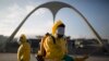 FILE - Health workers spray insecticide to combat the Aedes aegypti mosquito that transmits the Zika virus in Rio de Janeiro, Brazil, Jan. 26, 2016. 