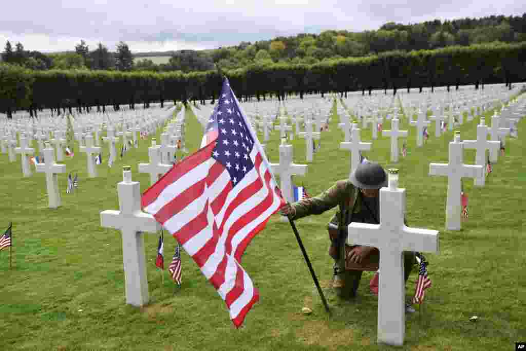 A man in WWI military uniform poses at the Meuse-Argonne American Cemetery, northeastern France, during a remembrance ceremony, Sept. 23, 2018.